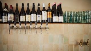 Wine bottles and wine taps at Orasay, Notting Hill