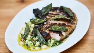 Tamworth chop with white butter beans and spring greens
