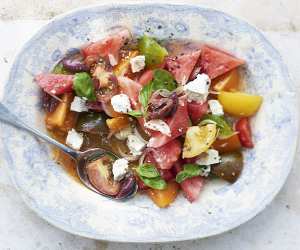 Watermelon and tomato salad with goat's cheese. Photograph by David Munns