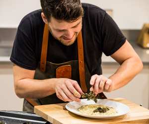Tom Hunt preparing his dish for Foodism at Tun Yard Studios. Photograph by David Harrison