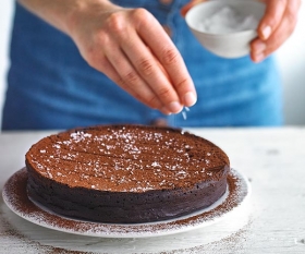 Alexandra Dudley's sea salt chocolate torte dusted with cocoa powder; Photograph by Andrew Burton