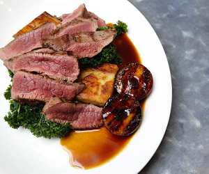 chef Cameron Emirali's plum venison with layered potato and kale; photography by Ella Singleton