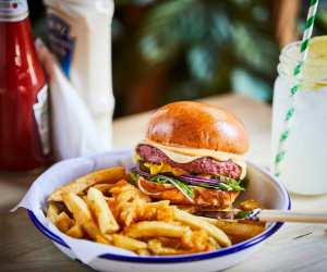 The Impossible Burger: Honest Burger's Plant is a vegan burger made from Beyond Meat with vegan smoked Gouda, Rubies in the Rubble Chipotle 'Mayo', mustard, red onion, pickles and lettuce