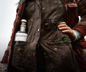 A forager with a bottle of The Botanist Gin