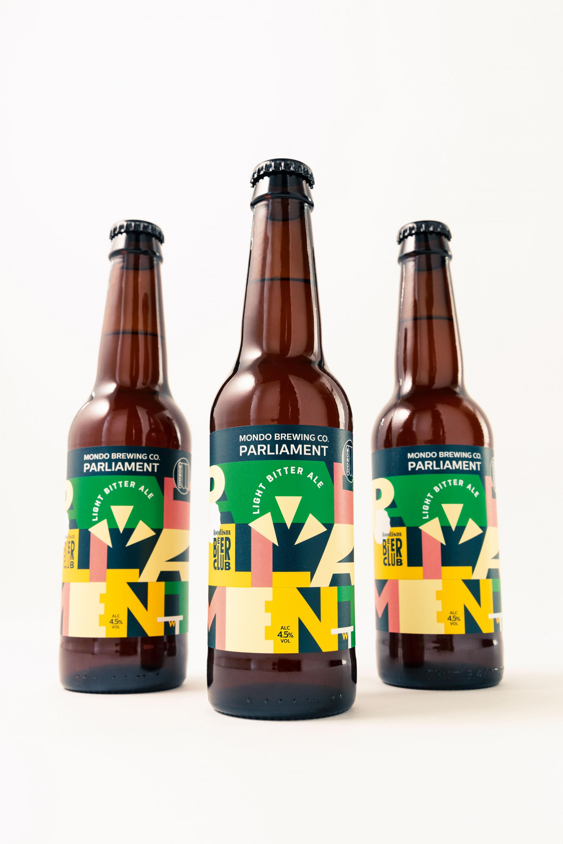 Bottles of Foodism and Mondo Brewing Company's Parliament Light Bitter Ale