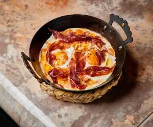 Best brunch London. Huevas a la flamenca with jamon iberico at Decimo at The Standard Hotel in King's Cross. Photo by Charlie McKay