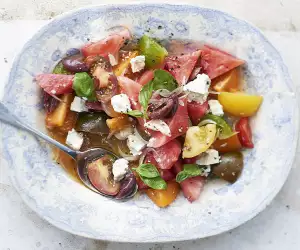 Watermelon and tomato salad with goat's cheese. Photograph by David Munns