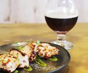 A modern Indian small plate and paired beer at Booma, Brixton