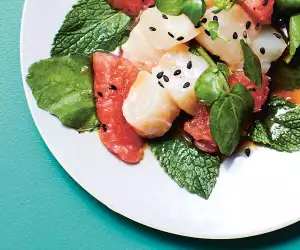Hawaiian-inspired sour sea bass with zingy grapefruit Ponzu dressing, mint and baby watercress. Photograph by Matt Russell