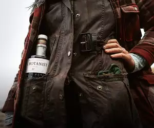 A forager with a bottle of The Botanist Gin