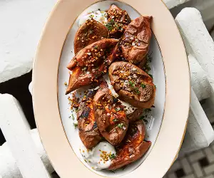 Alison Roman’s smashed sweet potatoes with maple syrup and sour cream; photography by Michael Graydon